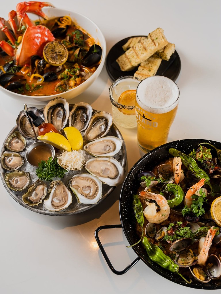 Oysters, cioppino, and a shrimp pan before a Canucks night