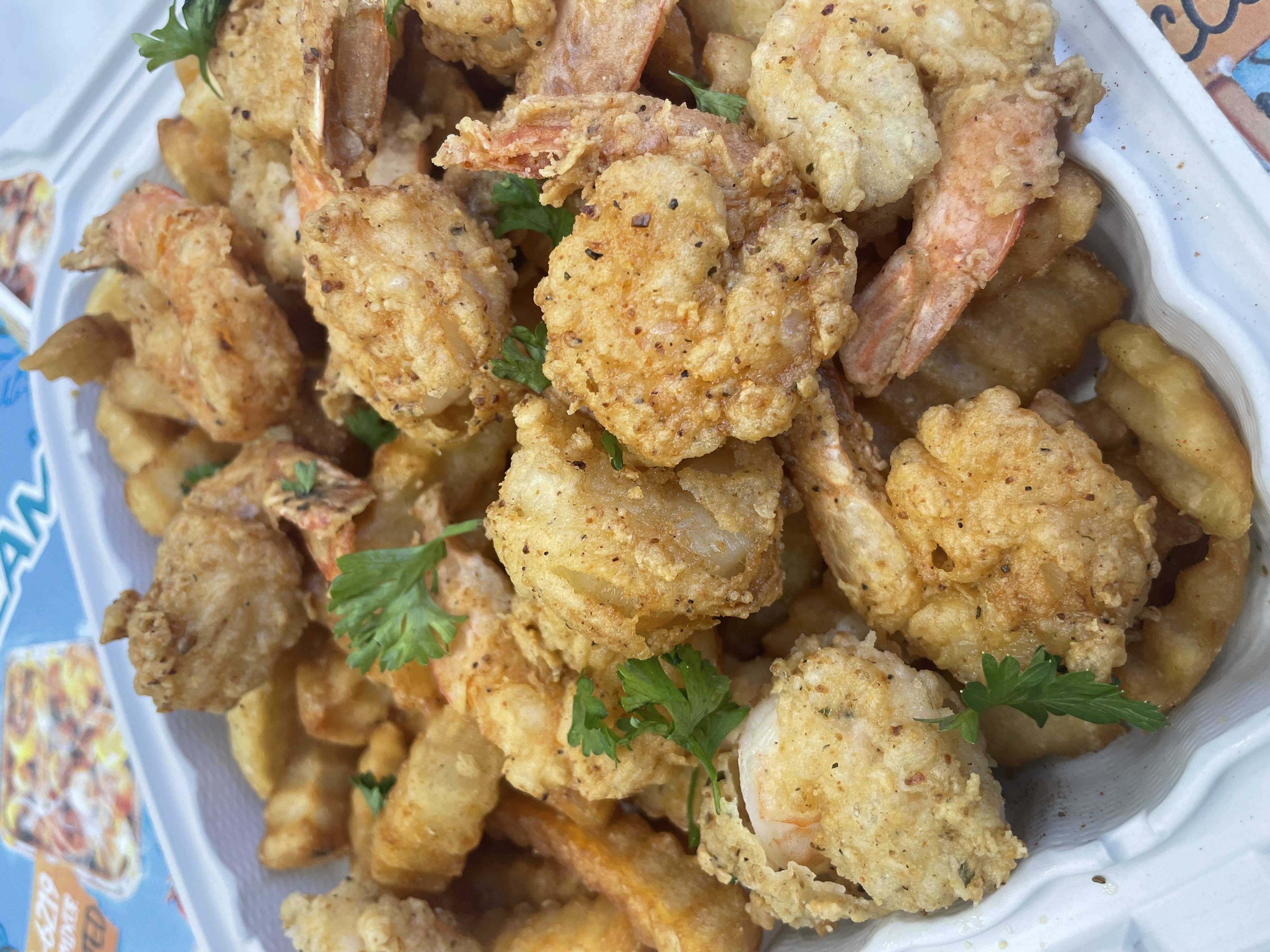 Fried shrimp over crinkle fries · photo: Seafood Mixer