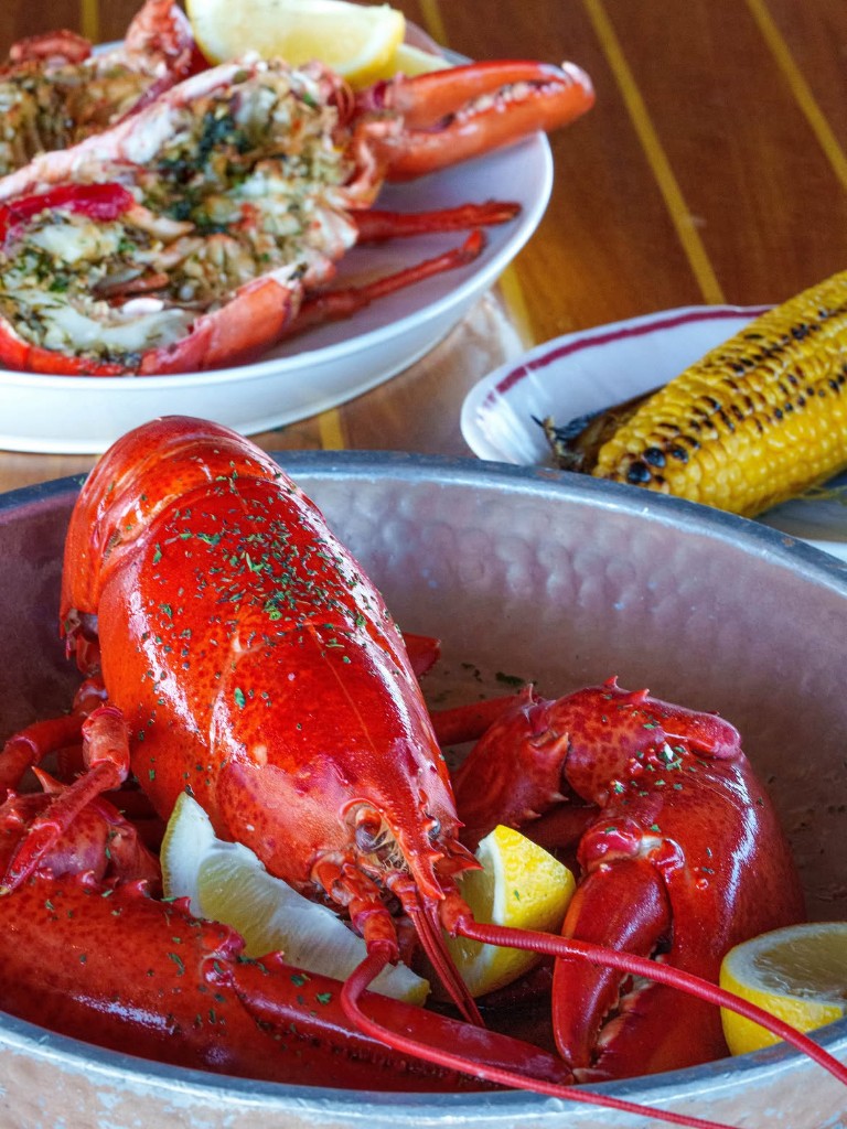 Whole steamed lobster, grilled halves, summer corn