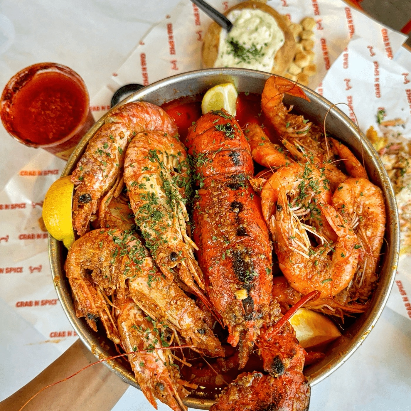 Seafood boil bowl with lobster and shrimp · photo: Crab N' Spice