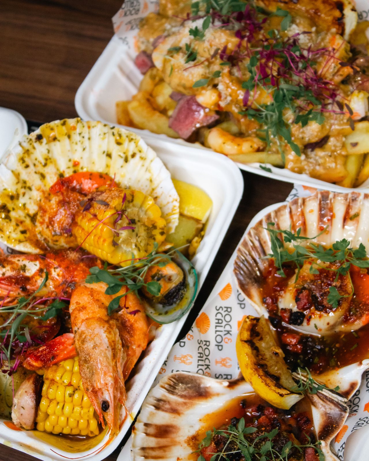 Platter: half-shell scallops, prawns, corn